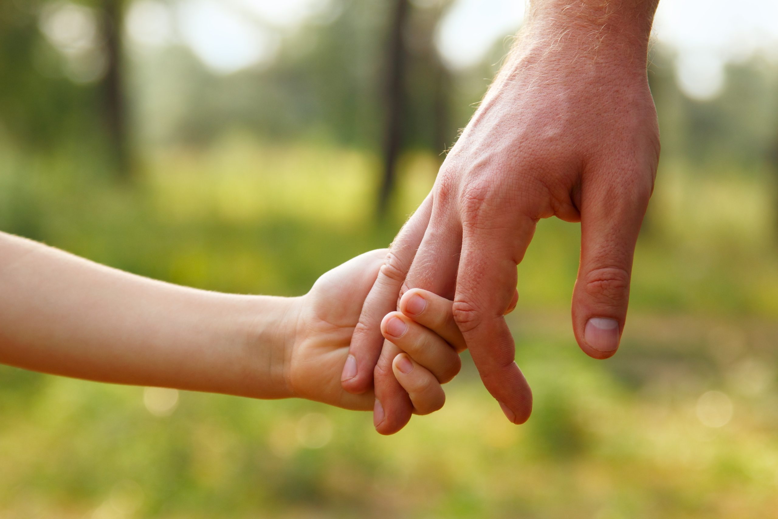 Parent and child holding hands