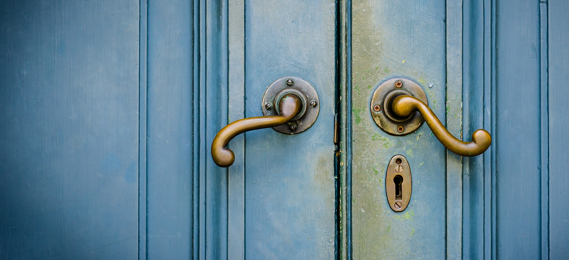 Blue door with brass handles